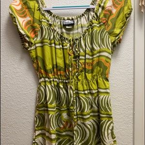 Baby doll type top, has a adjustable tie front that can worn loose or tight.